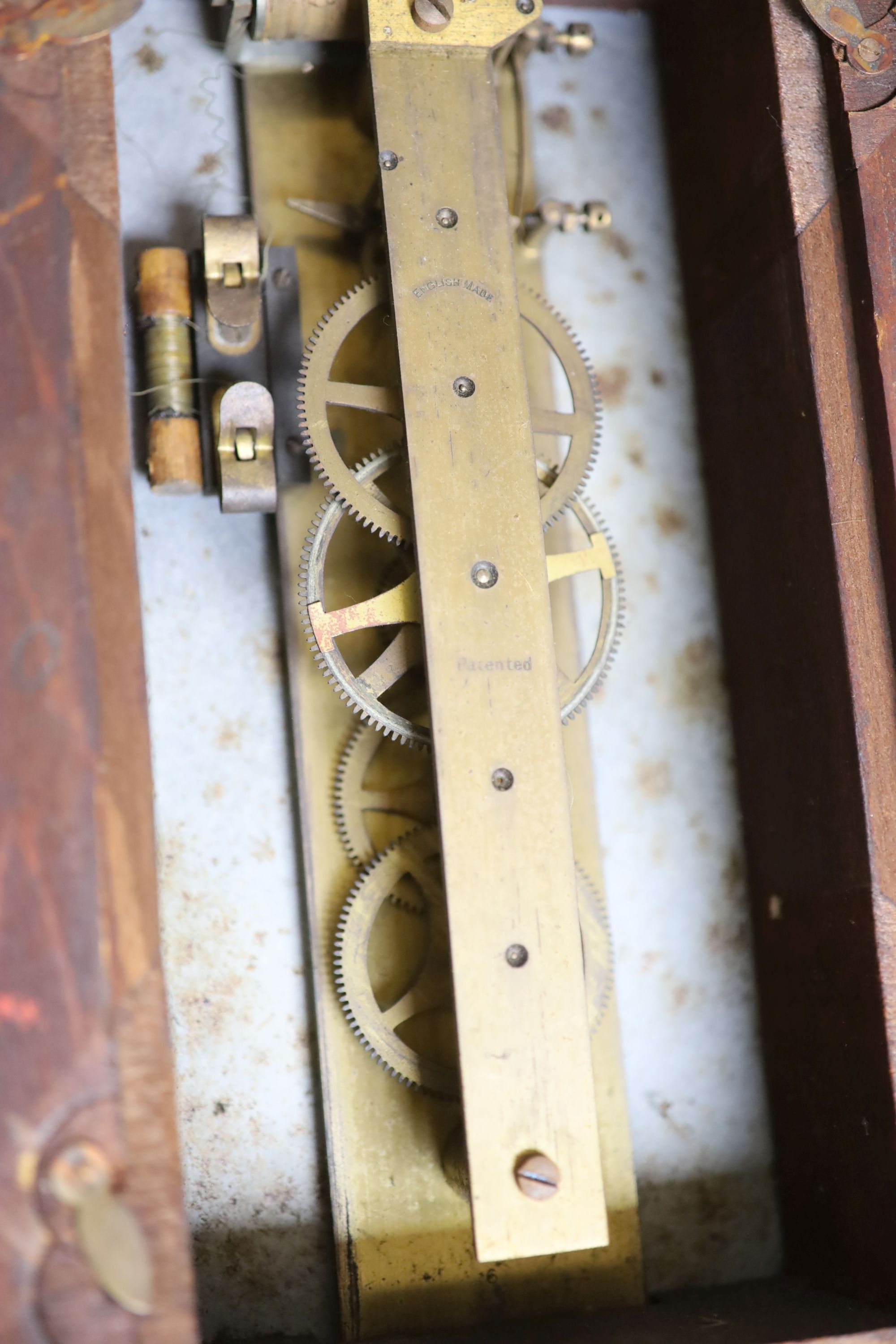 A Synchronome ebonised slave wall clock with two subsidiary dials,